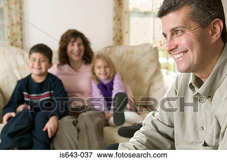 Father laughing with his family View Large Photo Image Stock Photo - Father laughing with his family. Fotosearch