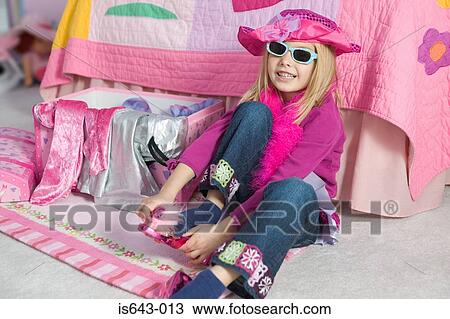 Girl dressing up in pink View Large Photo Image Stock Image - Girl dressing up in pink. Fotosearch