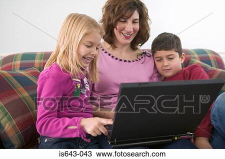 Mother and children using computer View Large Photo Image Stock Image - Mother and children using computer. Fotosearch