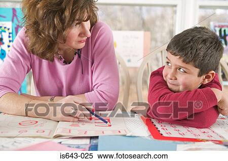Mother teaching son View Large Photo Image Stock Photography - Mother teaching son. Fotosearch