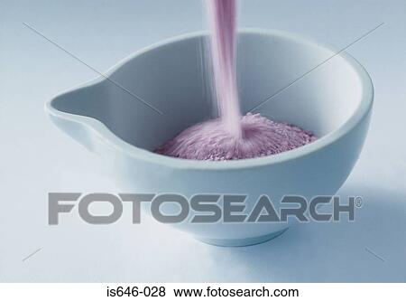 Pink bath salts being poured into a bowl View Large Photo Image Stock Photo - Pink bath salts being poured into a bowl. Fotosearch
