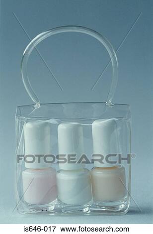 Three bottles of nail varnish in a bag View Large Photo Image Stock Photo - Three bottles of nail varnish in a bag. Fotosearch
