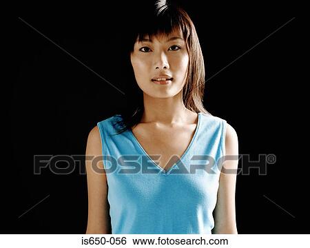 Young asian woman in blue vest View Large Photo Image Stock Photograph - Young asian woman in blue vest. Fotosearch