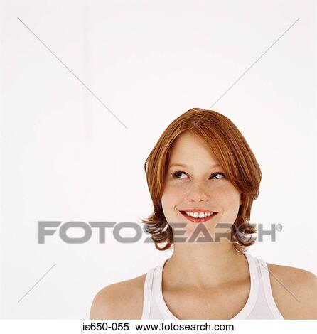 Stock Photography - Young red-headed woman. Fotosearch