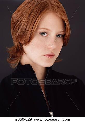 Stock Photo - Young woman looking serious. Fotosearch
