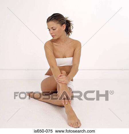 Stock Photography - Young woman posing in underwear. Fotosearch