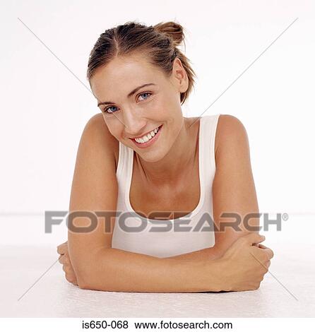 Stock Photo - Young woman resting on her arms. Fotosearch