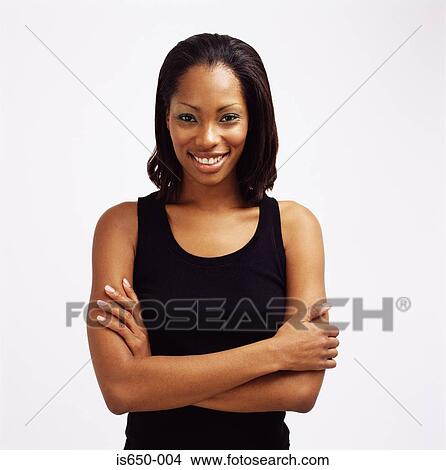 Young woman with arms folded View Large Photo Image Picture - Young woman with arms folded. Fotosearch