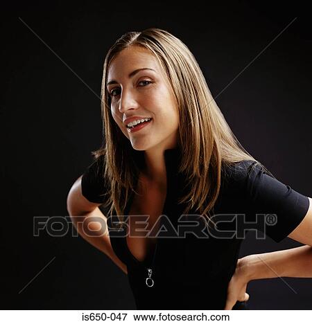 Stock Photo - Young woman with hands on hips. Fotosearch