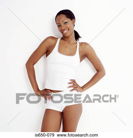 Stock Photo - Young woman with hands on hips. Fotosearch