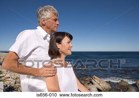 Mature couple by the sea View Large Photo Image Stock Image - Mature couple by the sea. Fotosearch