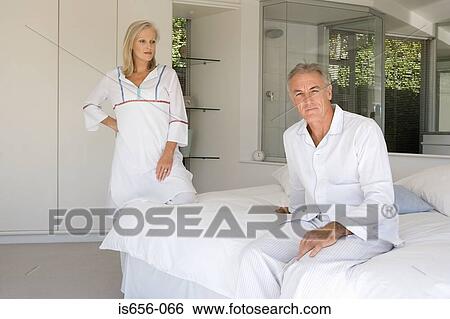 Mature couple in bedroom View Large Photo Image Stock Photograph - Mature couple in bedroom. Fotosearch