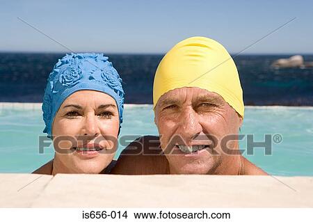 Mature couple in swimming caps View Large Photo Image Picture - Mature couple in swimming caps. Fotosearch