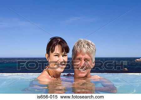 Mature couple in swimming pool View Large Photo Image Stock Photography - Mature couple in swimming pool. Fotosearch