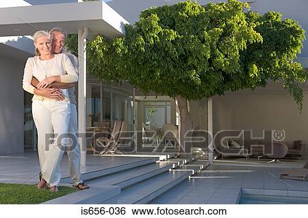 Stock Photograph - Mature couple on patio. Fotosearch