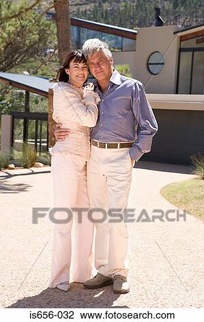 Mature couple outside house View Large Photo Image Stock Image - Mature couple outside house. Fotosearch