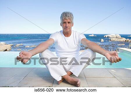 Stock Image - Mature man in yoga position . Fotosearch