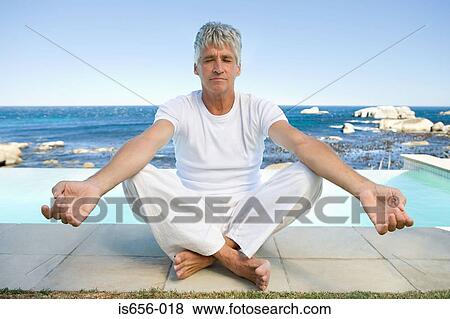 Mature man in yoga position View Large Photo Image Stock Photo - Mature man in yoga position . Fotosearch