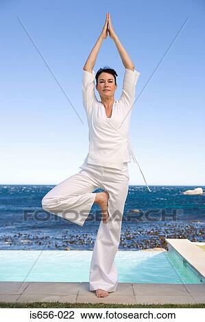Woman in yoga position View Large Photo Image Stock Image - Woman in yoga position . Fotosearch