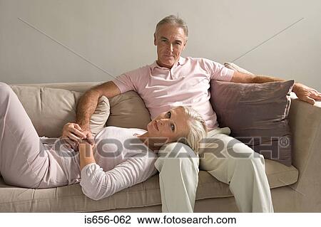 Woman lying in man's lap View Large Photo Image Stock Image - Woman lying in man's lap. Fotosearch