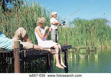Boy fishing with parents View Large Photo Image Stock Photography - Boy fishing with parents. Fotosearch