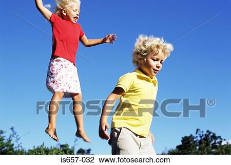 Stock Image - Children jumping. Fotosearch
