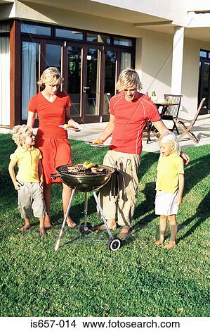 Picture - Family having barbecue. Fotosearch