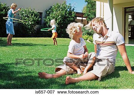 Family in garden View Large Photo Image Stock Photo - Family in garden. Fotosearch