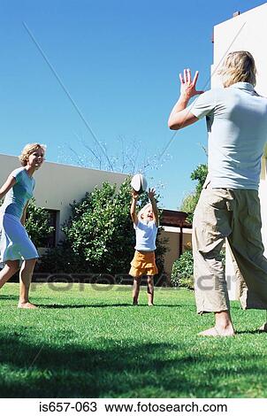 Family playing in garden View Large Photo Image Stock Image - Family playing in garden. Fotosearch