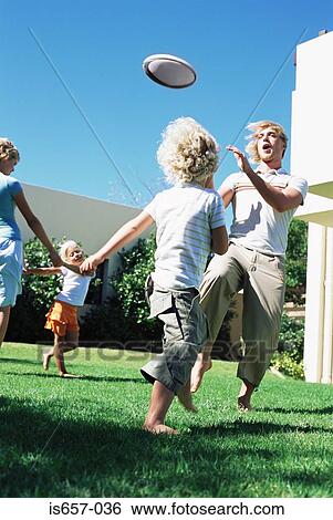 Family playing in garden View Large Photo Image Stock Photograph - Family playing in garden. Fotosearch