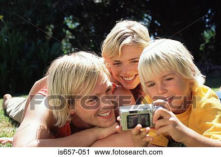 Family taking photographs View Large Photo Image Stock Image - Family taking photographs. Fotosearch