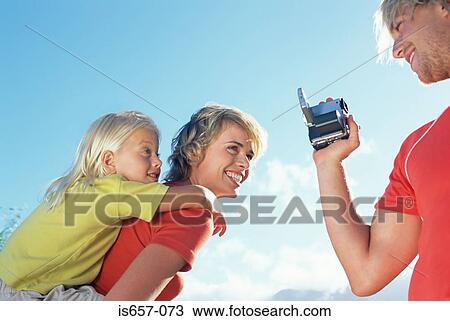 Father filming wife and daughter View Large Photo Image Stock Image - Father filming wife and daughter. Fotosearch
