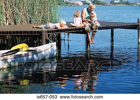 Father fishing with children View Large Photo Image Stock Image - Father fishing with children. Fotosearch