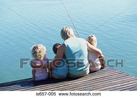 Father with children on jetty View Large Photo Image Stock Photography - Father with children on jetty. Fotosearch