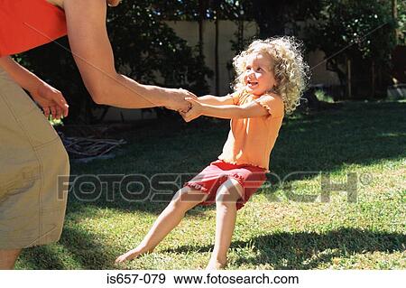 Girl pulling on father's hand View Large Photo Image Stock Photo - Girl pulling on father's hand. Fotosearch