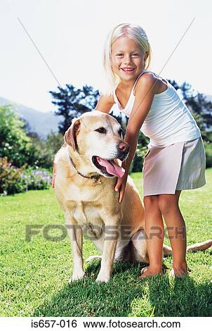 Stock Photograph - Girl with labrador. Fotosearch