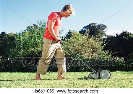 Man mowing lawn View Large Photo Image Stock Photo - Man mowing lawn. Fotosearch
