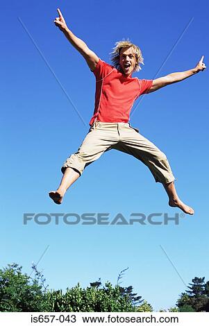 Stock Image - Young man jumping. Fotosearch