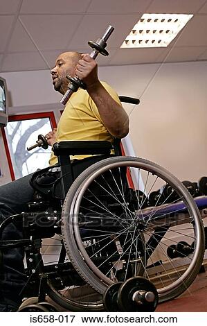 Stock Photo - Disabled man lifting weights. Fotosearch