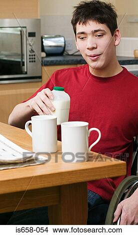 Disabled man making tea View Large Photo Image Picture - Disabled man making tea. Fotosearch