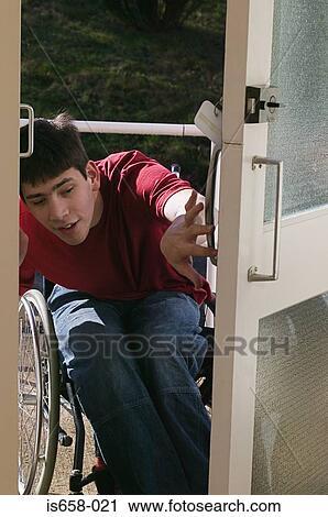 Disabled man opening front door View Large Photo Image Stock Image - Disabled man opening front door. Fotosearch