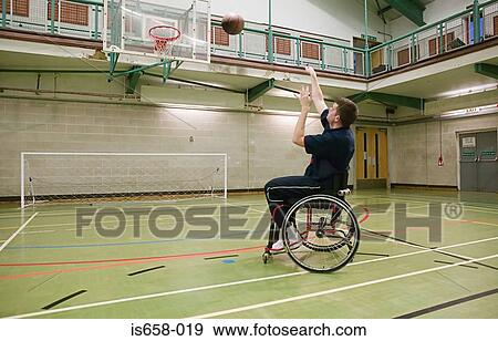 Disabled man playing basketball View Large Photo Image Stock Photo - Disabled man playing basketball. Fotosearch