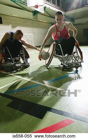 Stock Photography - Disabled man playing basketball. Fotosearch