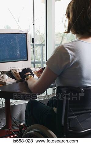 Disabled woman using a computer View Large Photo Image Stock Photo - Disabled woman using a computer. Fotosearch