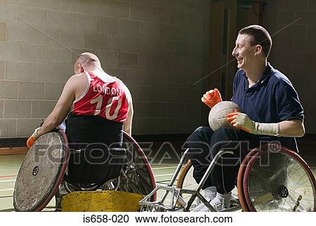 Stock Image - Men playing basketball. Fotosearch