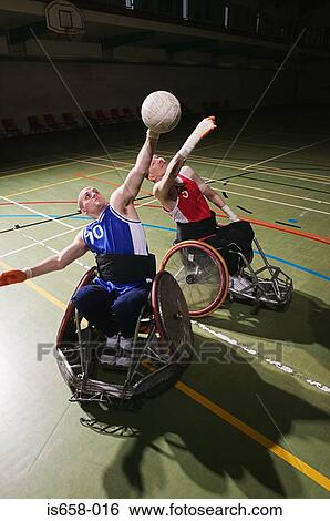 Stock Photograph - Men playing basketball. Fotosearch