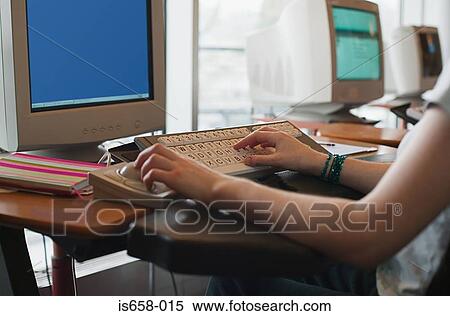 Someone using a specially adapted computer View Large Photo Image Stock Photography - Someone using a specially adapted computer. Fotosearch