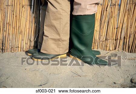 People in rubber boots back to back View Large Photo Image Stock Image - People in rubber boots back to back. Fotosearch