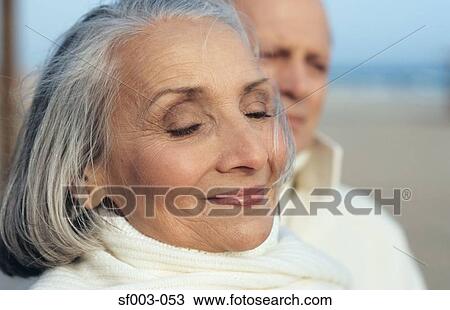 Stock Image - Senior couple at the beach. Fotosearch
