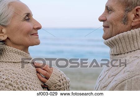 Senior couple face to face on the beach View Large Photo Image Stock Photo - Senior couple face to face on the beach. Fotosearch